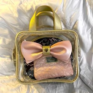Betsey Johnson see-through makeup bag, including two smaller makeup bags.